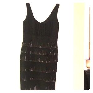 Black short dress with sequins.